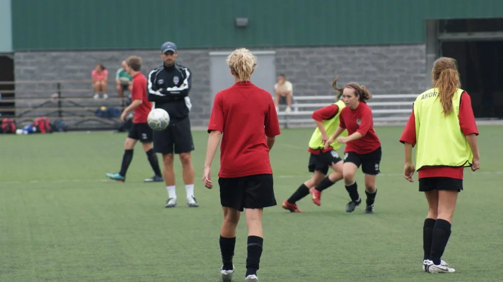 Soccer players practicing ball skills