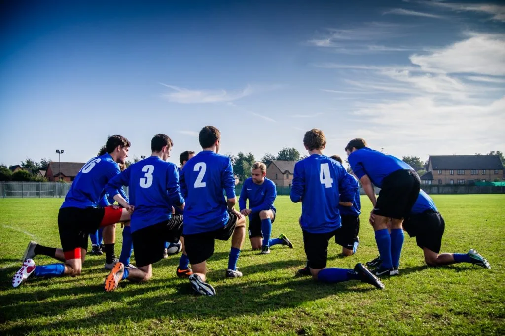 Men’s soccer players competing on the field